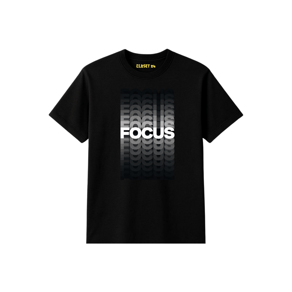 A black short sleeve t-shirt for men with a graphic on the front featuring tire tracks in a white gradient and the word 'FOCUS' in bold white letters. The inner collar shows the brand name 'CLOSET 24' in yellow.