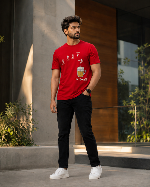 Model wearing Beer on Friday graphic printed t shirts for men with black pant and white sneakers outside a modern building.