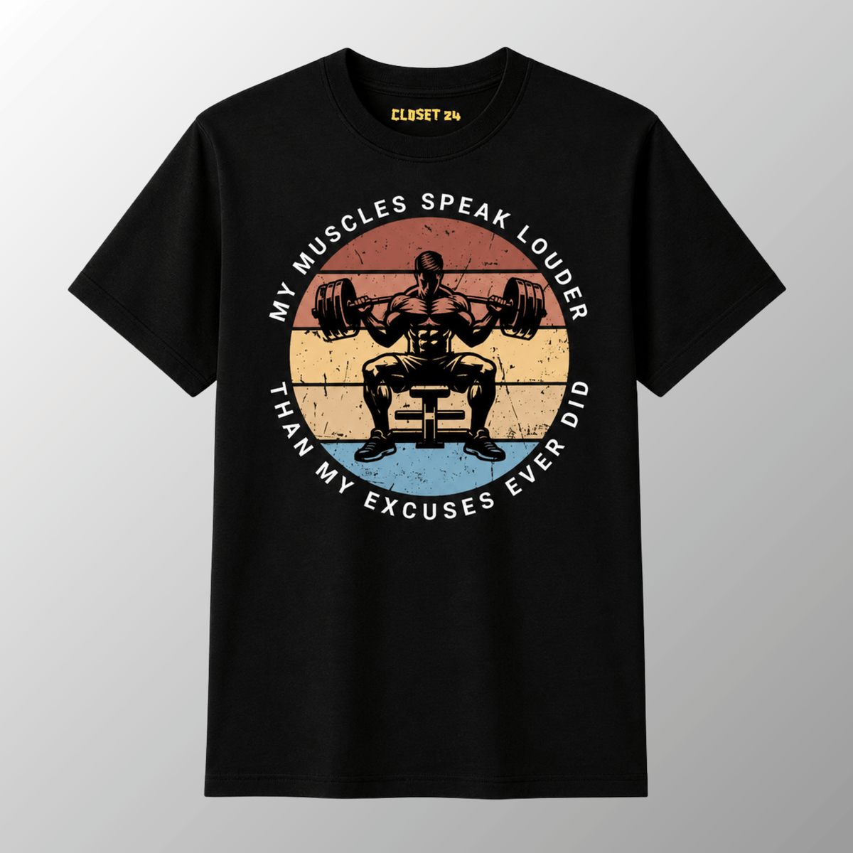 A black short-sleeve t-shirt with a vintage style graphic of a weightlifter squatting a barbell. The graphic features a circular design with the text 'MY MUSCLES SPEAK LOUDER THAN MY EXCUSES EVER DID'.