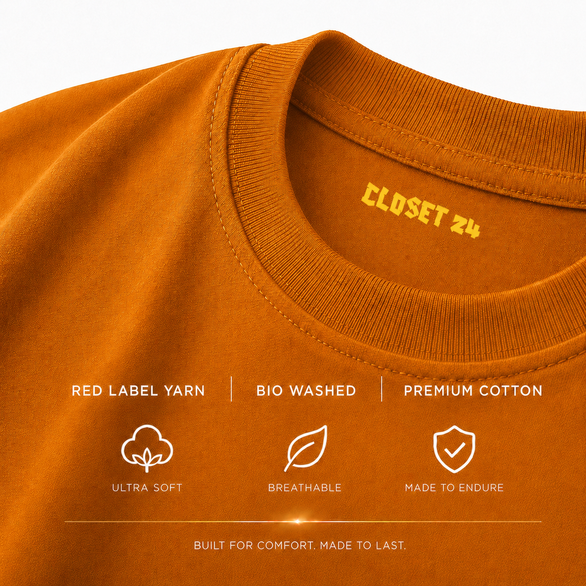 Close up of the orange t shirt for men showcasing the CLOSET 24 neck print with Red Label Yarn and bio-washed fabric.