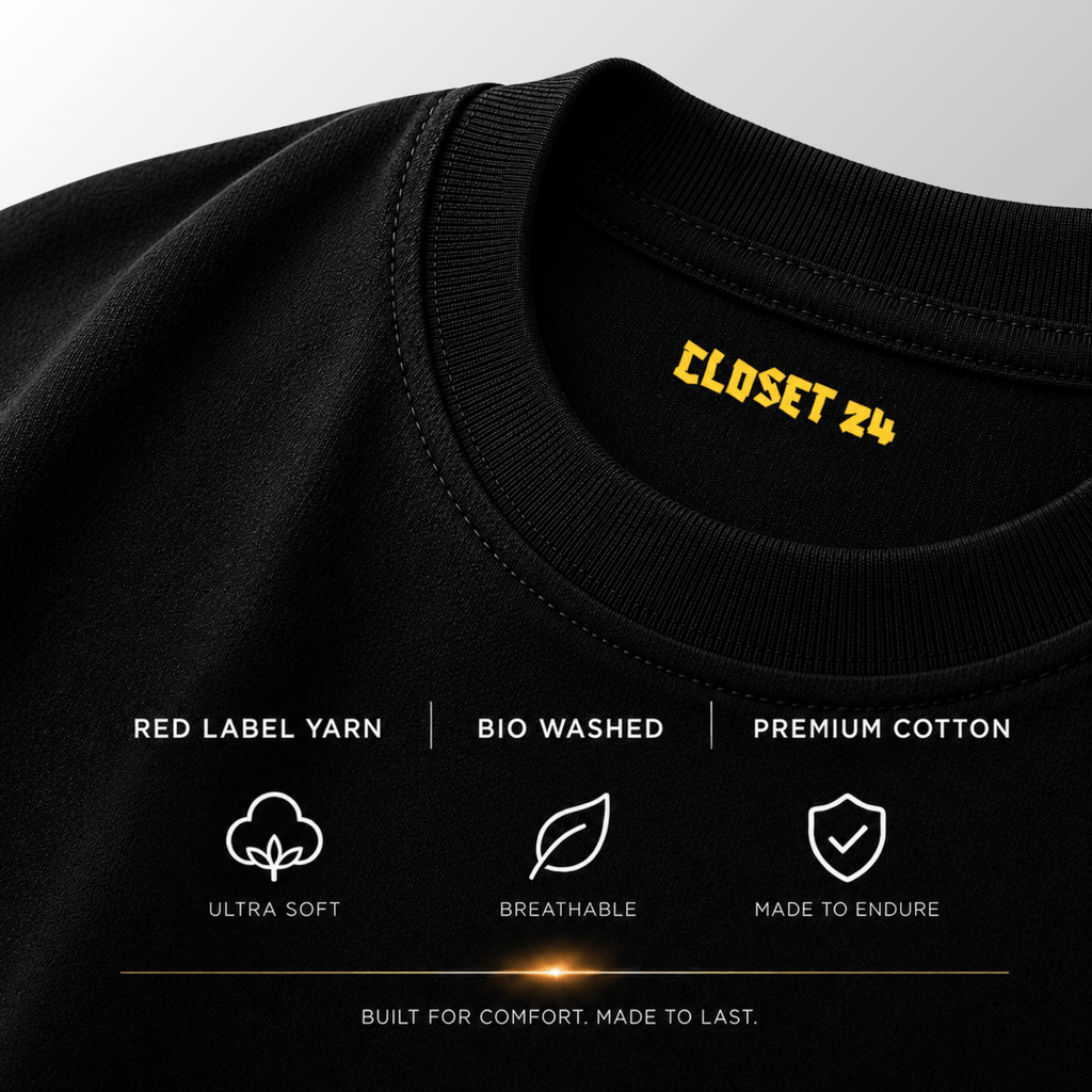 Close up of the black t shirt for men showcasing the CLOSET 24 neck print with Red Label Yarn and bio-washed fabric.
